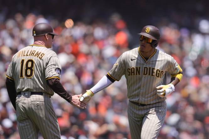 Manny Machado of the San Diego Padres rounds the bases after