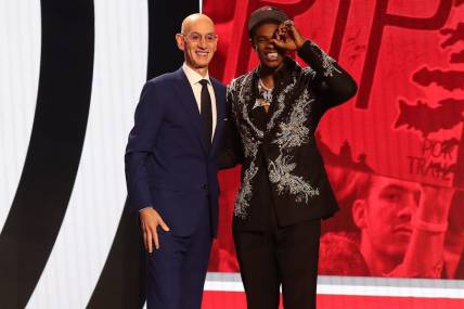 Jun 22, 2023; Brooklyn, NY, USA; Scoot Henderson with NBA commissioner Adam Silver after being selected third by the Portland Trail Blazers in the first round of the 2023 NBA Draft at Barclays Arena. Mandatory Credit: Wendell Cruz-USA TODAY Sports