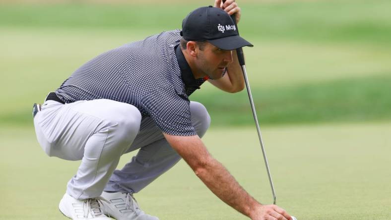 Jun 23, 2023; Cromwell, Connecticut, USA; Denny McCarthy lines up a putt on the seventh green during the second round of the Travelers Championship golf tournament. Mandatory Credit: Vincent Carchietta-USA TODAY Sports