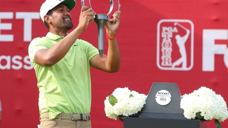 Tony Finau celebrates winning the Rocket Mortgage Classic at the Detroit Golf Club, Sunday, July 31, 2022.