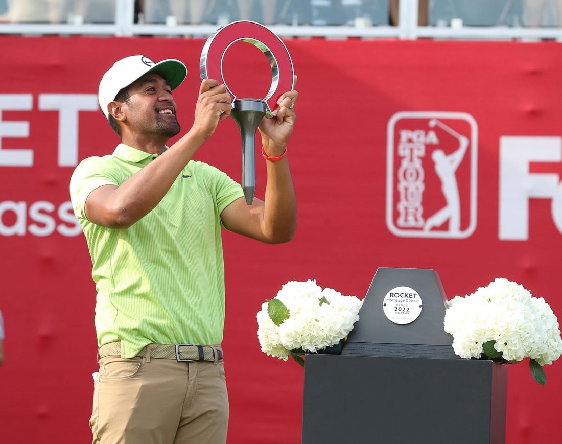 Tony Finau celebrates winning the Rocket Mortgage Classic at the Detroit Golf Club, Sunday, July 31, 2022.