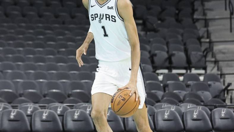 Jun 24, 2023; San Antonio, TX, USA; San Antonio Spurs draft pick Victor Wembanyama shoots around at a press conference at AT&T Center. Mandatory Credit: Troy Taormina-USA TODAY Sports