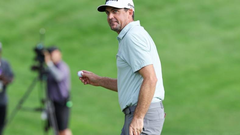 Jun 24, 2023; Cromwell, Connecticut, USA; Keegan Bradley gestures to fans after finishing his round on the 18th green during the third round of the Travelers Championship golf tournament. Mandatory Credit: Vincent Carchietta-USA TODAY Sports