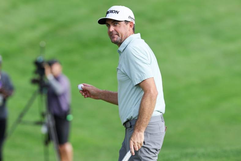 Jun 24, 2023; Cromwell, Connecticut, USA; Keegan Bradley gestures to fans after finishing his round on the 18th green during the third round of the Travelers Championship golf tournament. Mandatory Credit: Vincent Carchietta-USA TODAY Sports