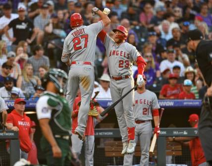 Jun 24, 2023; Denver, Colorado, USA; Los Angeles Angels center fielder Mike Trout (27) celebrates his home run with Los Angeles Angels second baseman Brandon Drury (23) in the third inning against the Colorado Rockies at Coors Field. Mandatory Credit: John Leyba-USA TODAY Sports
