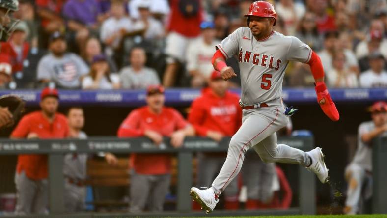 Jun 24, 2023; Denver, Colorado, USA; Los Angeles Angels third baseman Eduardo Escobar (5) sprints home to score in the third inning against the Colorado Rockies at Coors Field. Mandatory Credit: John Leyba-USA TODAY Sports