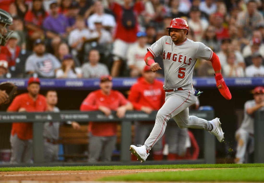 Jun 24, 2023; Denver, Colorado, USA; Los Angeles Angels third baseman Eduardo Escobar (5) sprints home to score in the third inning against the Colorado Rockies at Coors Field. Mandatory Credit: John Leyba-USA TODAY Sports