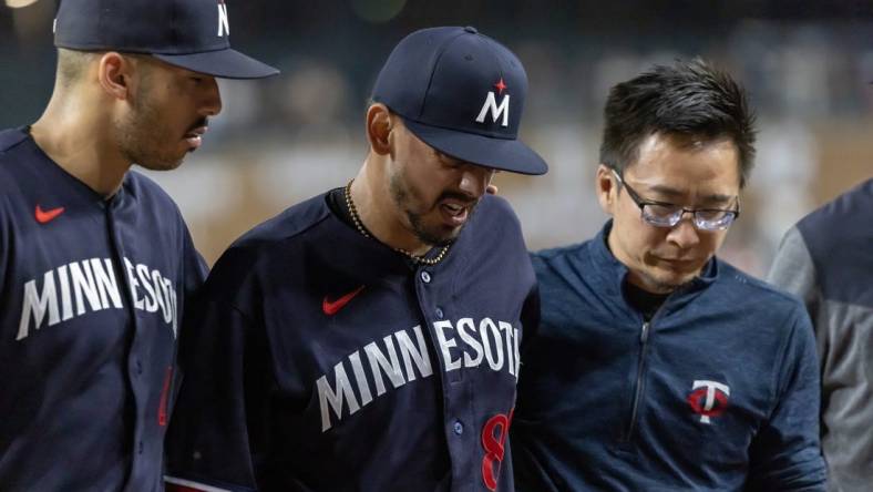 Jun 24, 2023; Detroit, Michigan, USA; Minnesota Twins relief pitcher Jose De Leon (87) leaves the game during his warmups with an injury before the start of the eighth inning against the Detroit Tigers at Comerica Park. Mandatory Credit: David Reginek-USA TODAY Sports