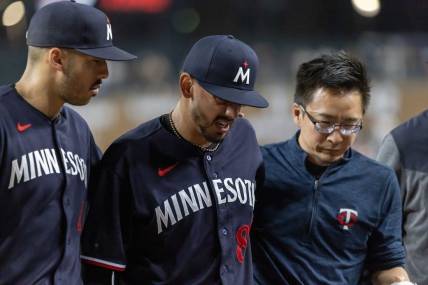 Jun 24, 2023; Detroit, Michigan, USA; Minnesota Twins relief pitcher Jose De Leon (87) leaves the game during his warmups with an injury before the start of the eighth inning against the Detroit Tigers at Comerica Park. Mandatory Credit: David Reginek-USA TODAY Sports