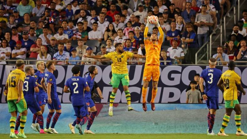 Jun 24, 2023; Chicago, Illinois, USA; United States goalkeeper Matt Turner (1) makes a save against Jamaica defender Adrian Mariappa (19) during the first half at Soldier Field. Mandatory Credit: Jon Durr-USA TODAY Sports