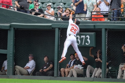 Jun 25, 2023; Baltimore, Maryland, USA; Baltimore Orioles right fielder Anthony Santander (25) makes a catch at the wall during the first inning against the Seattle Mariners at Oriole Park at Camden Yards. Mandatory Credit: Reggie Hildred-USA TODAY Sports