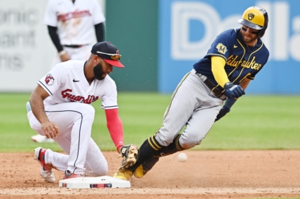 Jun 25, 2023; Cleveland, Ohio, USA; Milwaukee Brewers third baseman Owen Miller (6) is safe at second with an RBI double as Cleveland Guardians shortstop Amed Rosario (1) can not handle the throw during the third inning at Progressive Field. Mandatory Credit: Ken Blaze-USA TODAY Sports