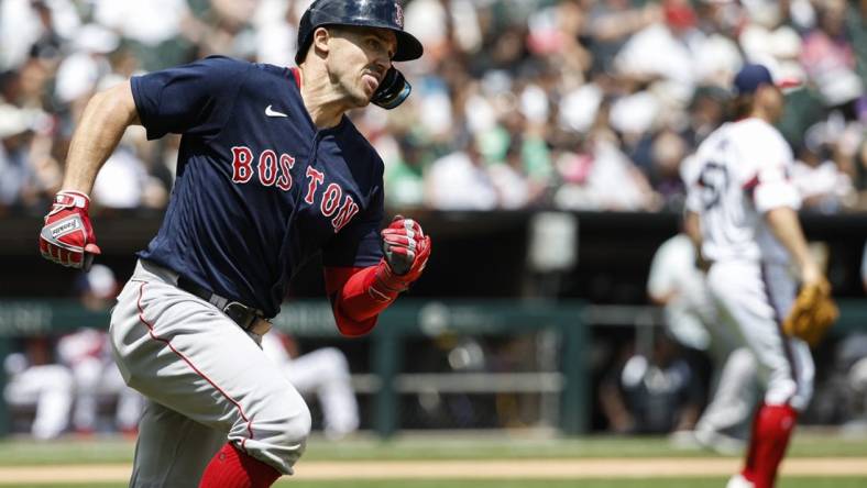 Jun 25, 2023; Chicago, Illinois, USA; Boston Red Sox center fielder Adam Duvall (18) runs after hitting an RBI-double against the Chicago White Sox during the third inning at Guaranteed Rate Field. Mandatory Credit: Kamil Krzaczynski-USA TODAY Sports