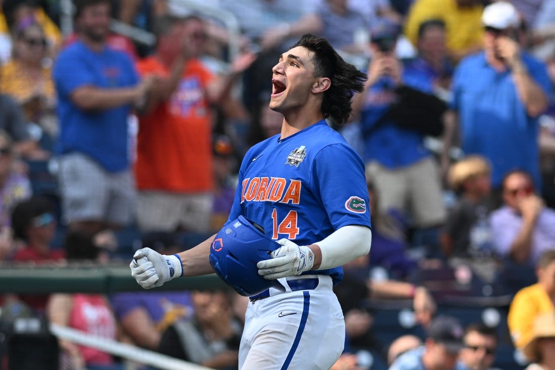 Jun 25, 2023; Omaha, NE, USA;  Florida Gators first baseman Jac Caglianone (14) celebrates hitting a home run against the LSU Tigers in the eighth inning at Charles Schwab Field Omaha. Mandatory Credit: Steven Branscombe-USA TODAY Sports