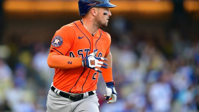 Jun 25, 2023; Los Angeles, California, USA; Houston Astros third baseman Alex Bregman (2) runs after hitting an RBI single against the Los Angeles Dodgers during the eleventh inning at Dodger Stadium. Mandatory Credit: Gary A. Vasquez-USA TODAY Sports