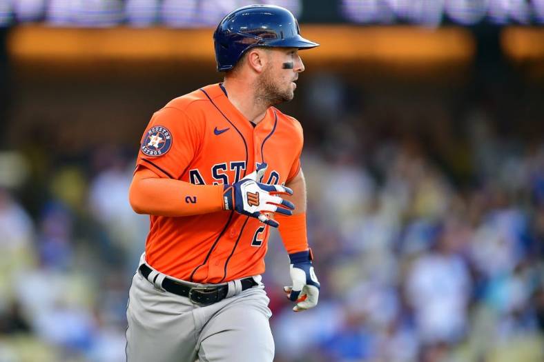 Jun 25, 2023; Los Angeles, California, USA; Houston Astros third baseman Alex Bregman (2) runs after hitting an RBI single against the Los Angeles Dodgers during the eleventh inning at Dodger Stadium. Mandatory Credit: Gary A. Vasquez-USA TODAY Sports