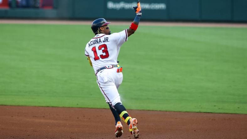 Jun 27, 2023; Atlanta, Georgia, USA; Atlanta Braves right fielder Ronald Acuna Jr. (13) reacts after a home run against the Minnesota Twins in the first inning at Truist Park. Mandatory Credit: Brett Davis-USA TODAY Sports