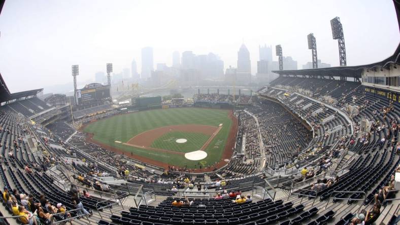 Jun 29, 2023; Pittsburgh, Pennsylvania, USA; A general view of smoky skies, a result of the Canadian wildfires, obscuring the Pittsburgh downtown skyline and delays the start of the game between the San Diego Padres and the Pittsburgh Pirates at PNC Park. Mandatory Credit: Charles LeClaire-USA TODAY Sports