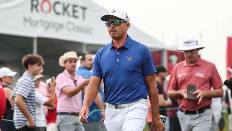 Rickie Fowler walks towards the 16th tee box during the first round of Rocket Mortgage Classic at Detroit Golf Club in Detroit on Thursday, June 29, 2023.