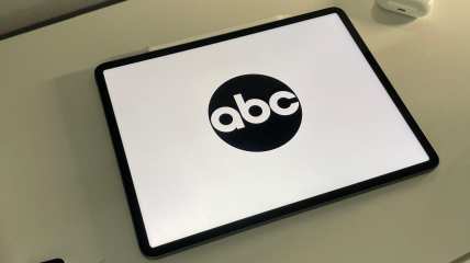 abc logo on an iPad sitting on a desk