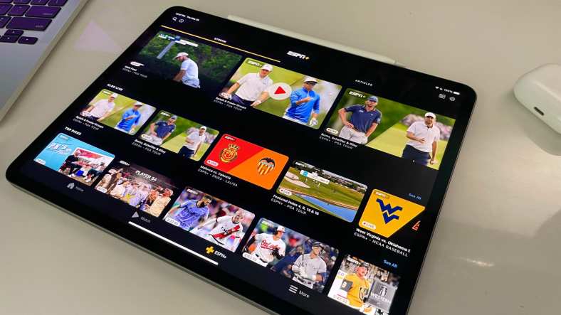 multiple sports streaming options on an ipad sitting on a desk