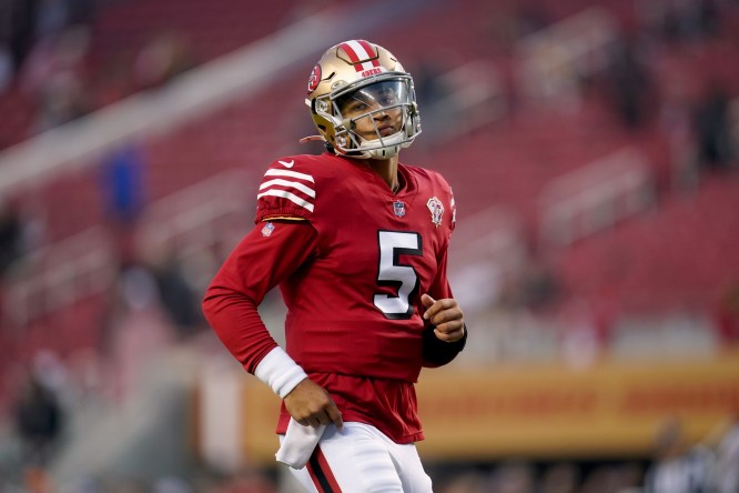 San Francisco 49ers quarterback Trey Lance (5) looks on from the