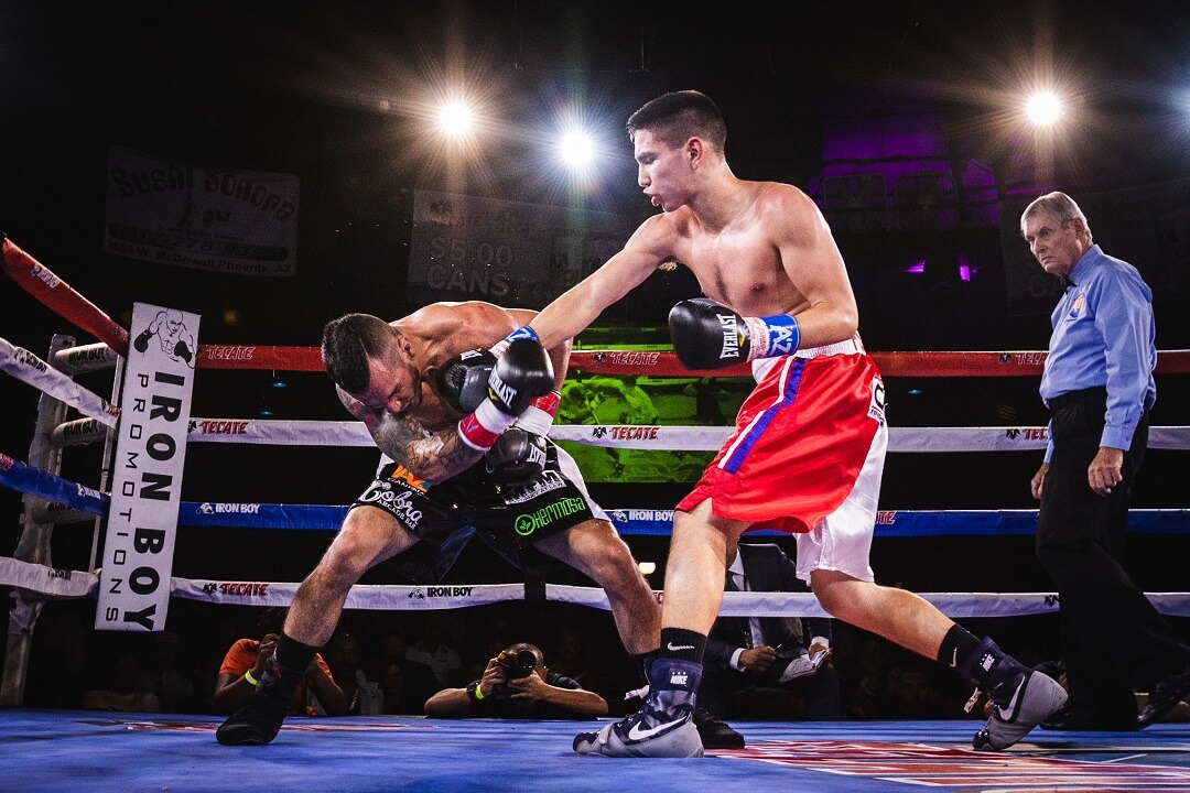 Premium Photo | Young woman watch boxing on tv at night