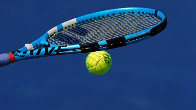 Aug 15, 2019; Mason, OH, USA; A view of the Western and Southern Open tennis ball on the racquet of Rebecca Peterson (SWE) as she prepares to serve against Karolina Pliskova (CZE) during the Western and Southern Open tennis tournament at Lindner Family Tennis Center. Mandatory Credit: Aaron Doster-USA TODAY Sports