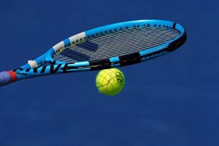 Aug 15, 2019; Mason, OH, USA; A view of the Western and Southern Open tennis ball on the racquet of Rebecca Peterson (SWE) as she prepares to serve against Karolina Pliskova (CZE) during the Western and Southern Open tennis tournament at Lindner Family Tennis Center. Mandatory Credit: Aaron Doster-USA TODAY Sports