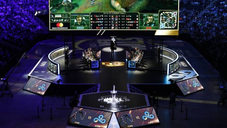 Aug 25, 2019; Detroit, MI, USA; Team Liquid (center left) competes against Cloud9 (center right) during the LCS Summer Finals event at Little Caesars Arena. Mandatory Credit: Raj Mehta-USA TODAY Sports