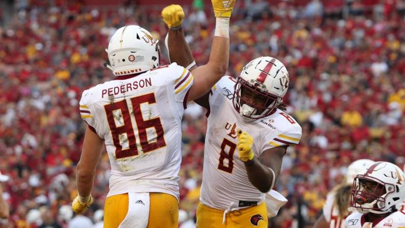 Sep 21, 2019; Ames, IA, USA; Louisiana Monroe Warhawks tight end Josh Pederson (86) and Louisiana Monroe Warhawks running back Josh Johnson (8) celebrate after a touchdown against the Iowa State Cyclones at Jack Trice Stadium. Mandatory Credit: Reese Strickland-USA TODAY Sports