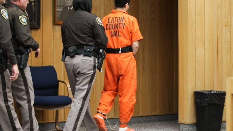 One of the very last times Larry Nassar was seen publicly, as he leaves Eaton County Court in Charlotte, Mich., Monday, Feb. 5, 2018, after being sentenced by Judge Janice Cunningham to 40-125 years in prison on three counts of sexual assault.  [MATTHEW DAE SMITH/Lansing State Journal]

Day Three Nassar Sentencing In Eaton County