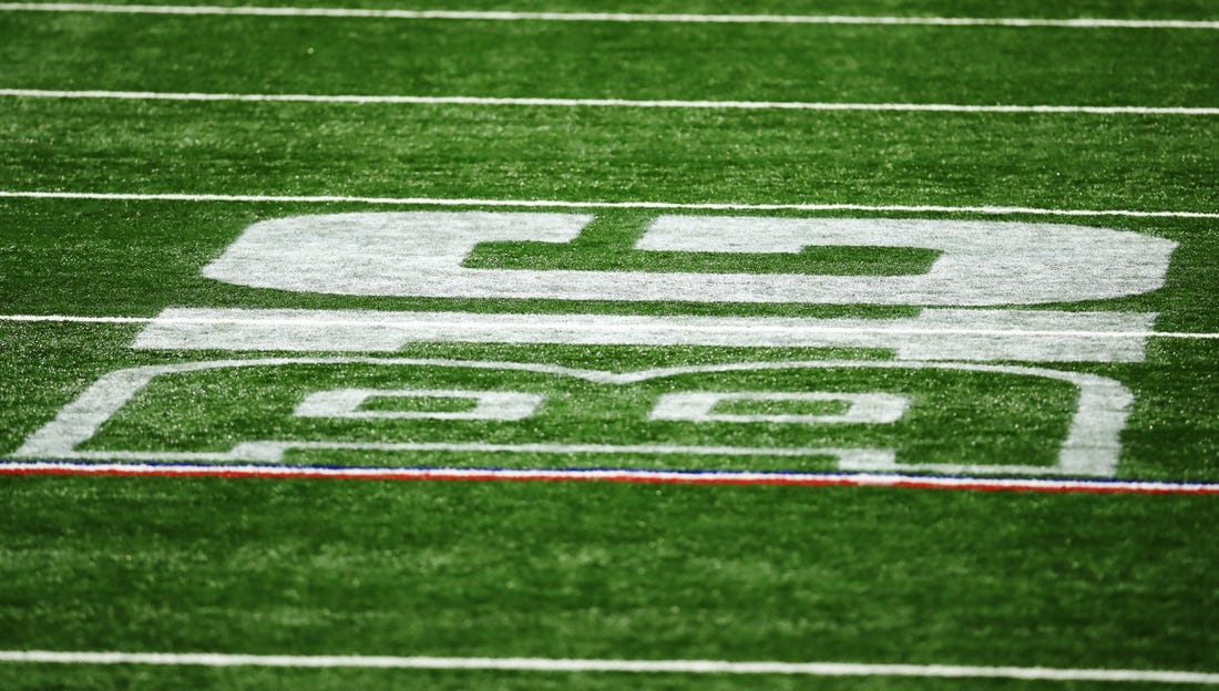 Dec 19, 2020; Indianapolis, Indiana, USA; The Big 10 Conference logo is seen on the field during the first half between the Ohio State Buckeyes and the Northwestern Wildcats at Lucas Oil Stadium. Mandatory Credit: Aaron Doster-USA TODAY Sports