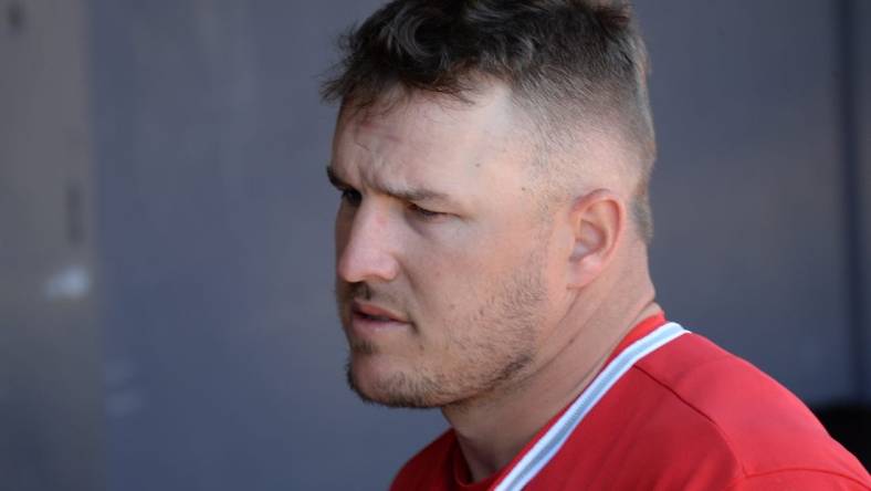 Mar 21, 2021; Peoria, Arizona, USA; Los Angeles Angels center fielder Mike Trout (27) looks on against the San Diego Padres during the fifth inning of a spring training game at Peoria Sports Complex. Mandatory Credit: Joe Camporeale-USA TODAY Sports