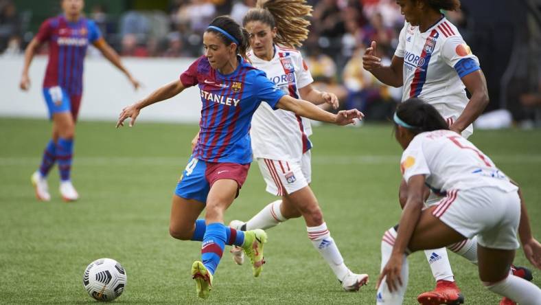 Aug 18, 2021; Portland, OR, USA;  FC Barcelona midfielder Aitana Bonmati (14) passes the ball against Olympique Lyonnais during the second half at Providence Park. Olympique Lyonnais won 3-2. Mandatory Credit: Troy Wayrynen-USA TODAY Sports