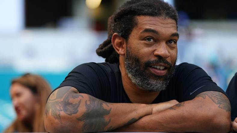 Nov 28, 2021; Miami Gardens, Florida, USA;  Carolina Panthers former defensive end Julius Peppers sits in the stands prior to the game between the Miami Dolphins and the Carolina Panthers at Hard Rock Stadium. Mandatory Credit: Jasen Vinlove-USA TODAY Sports