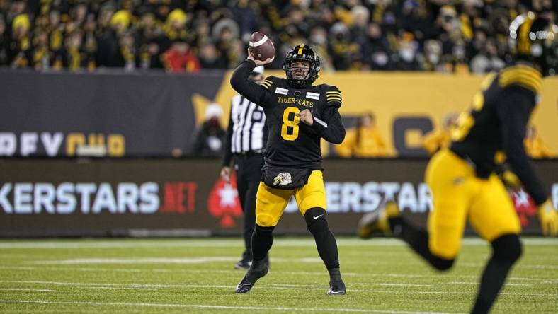 Dec 12, 2021; Hamilton, Ontario, CAN; Hamilton Tiger-Cats quarterback Jeremiah Masoli (8) throws a pass against the Winnipeg Blue Bombers during the second half of the 108th Grey Cup football game at Tim Hortons Field. Mandatory Credit: John E. Sokolowski-USA TODAY Sports