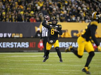 Dec 12, 2021; Hamilton, Ontario, CAN; Hamilton Tiger-Cats quarterback Jeremiah Masoli (8) throws a pass against the Winnipeg Blue Bombers during the second half of the 108th Grey Cup football game at Tim Hortons Field. Mandatory Credit: John E. Sokolowski-USA TODAY Sports