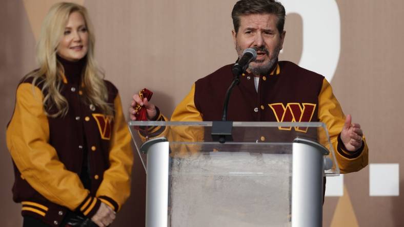 Feb 2, 2022; Landover, MD, USA; Washington Commanders co-owner Dan Snyder speaks as co-owner Tanya Snyder (L) listens during a press conference revealing the Commanders as the new name for the formerly named Washington Football Team at FedEx Field. Mandatory Credit: Geoff Burke-USA TODAY Sports