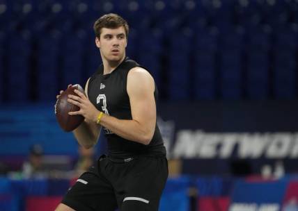 Mar 3, 2022; Indianapolis, IN, USA; Kent State quarterback Dustin Crum (QB03) throws a pass during the 2022 NFL Scouting Combine at Lucas Oil Stadium. Mandatory Credit: Kirby Lee-USA TODAY Sports