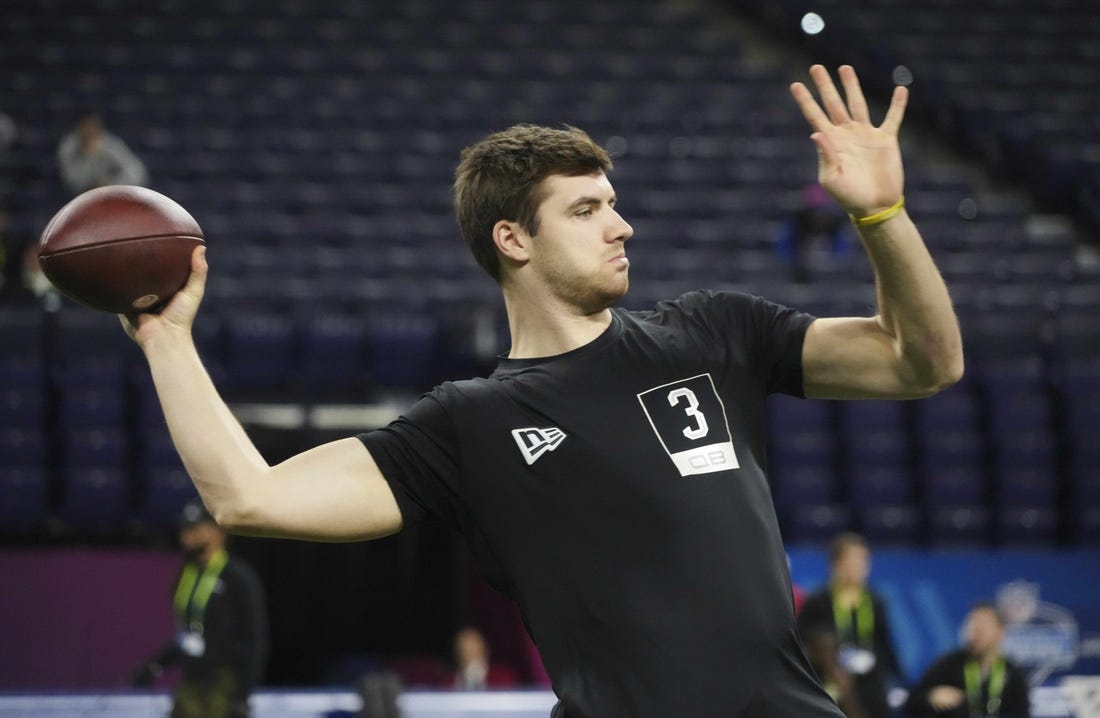 Mar 5, 2022; Indianapolis, IN, USA; Kent State quarterback Dustin Crum (QB03) goes through drills during the 2022 NFL Scouting Combine at Lucas Oil Stadium. Mandatory Credit: Kirby Lee-USA TODAY Sports