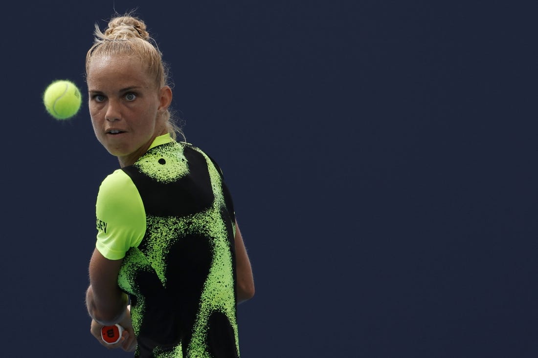 Mar 22, 2022; Miami Gardens, FL, USA; Arantxa Rus of Netherlands hits a backhand against Heather Watson of Great Britain (not pictured) in a first round women's singles match in the Miami Open at Hard Rock Stadium. Mandatory Credit: Geoff Burke-USA TODAY Sports