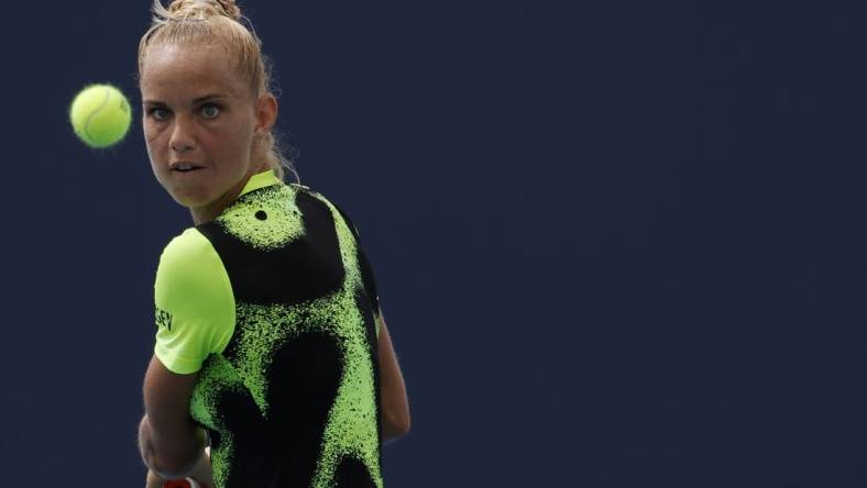 Mar 22, 2022; Miami Gardens, FL, USA; Arantxa Rus of Netherlands hits a backhand against Heather Watson of Great Britain (not pictured) in a first round women's singles match in the Miami Open at Hard Rock Stadium. Mandatory Credit: Geoff Burke-USA TODAY Sports