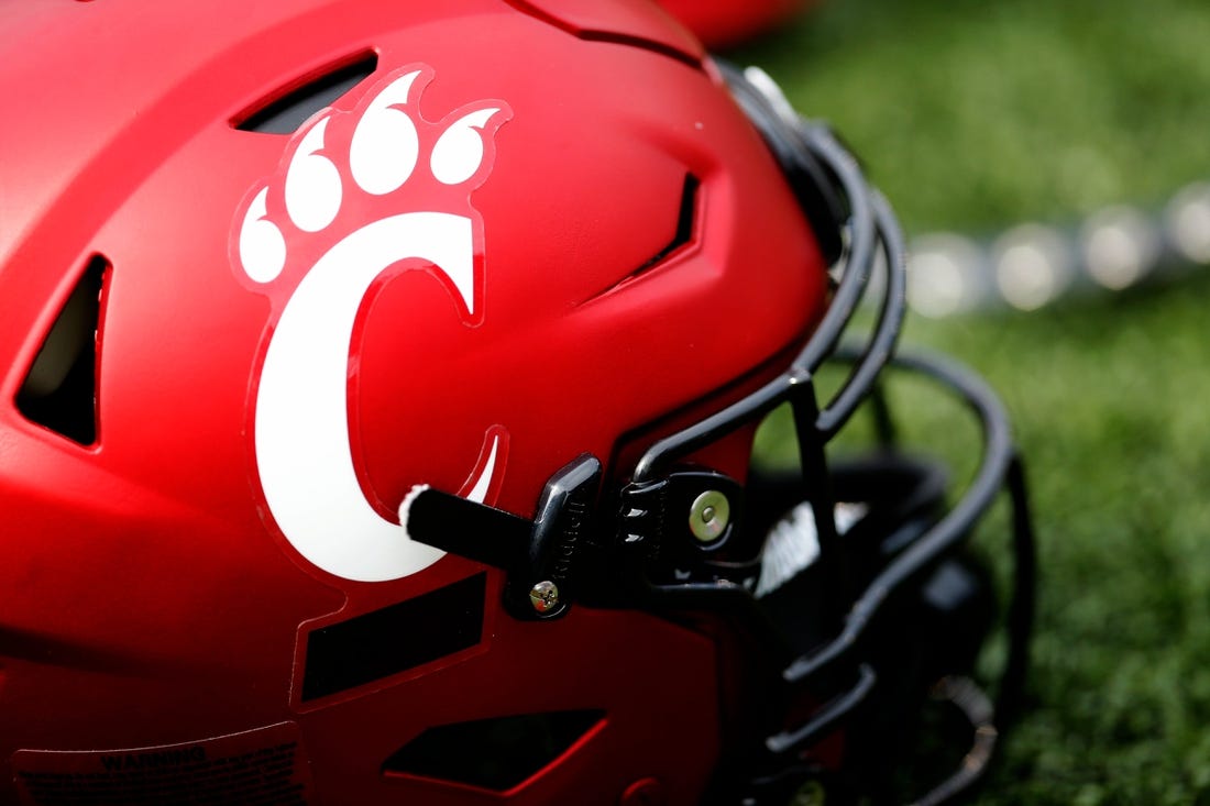 A Cincinnati Bearcats helmet lays on the turf during a spring practice at Nippert Stadium in Cincinnati on Thursday, March 24, 2022.

Cincinnati Bearcats Spring Practice