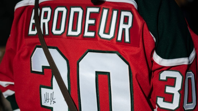 A fan with a signed Martin Brodeur jersey stands outside of the Adirondack Bank Center in Utica on Wednesday, April 6, 2022.

Martin Brodeur And Rob Esche