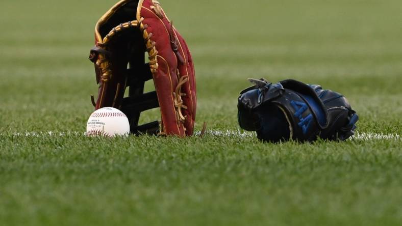 Apr 20, 2022; Washington, District of Columbia, USA;  A detail view of a glove a baseball on the the field before the game between the Washington Nationals and the Arizona Diamondbacks at Nationals Park. Mandatory Credit: Tommy Gilligan-USA TODAY Sports