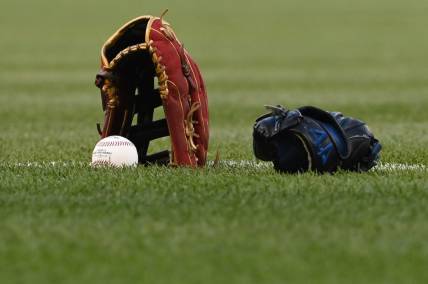 Apr 20, 2022; Washington, District of Columbia, USA;  A detail view of a glove a baseball on the the field before the game between the Washington Nationals and the Arizona Diamondbacks at Nationals Park. Mandatory Credit: Tommy Gilligan-USA TODAY Sports