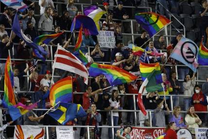 May 4, 2022; Washington, DC, USA; Washington Spirit supporters wave flags in the stands during a penalty kick shootout against OL Reign of a semifinal in the NWSL Challenge Cup at Audi Field. Mandatory Credit: Geoff Burke-USA TODAY Sports