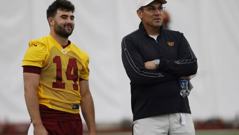 May 6, 2022; Ashburn, Virginia, USA; Washington Commanders head coach Ron Rivera (R) talks with Commanders quarterback Sam Howell (14) during Washington Commanders rookie minicamp at Inova Performance Center In Ashburn, VA. Mandatory Credit: Geoff Burke-USA TODAY Sports