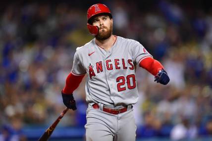 Jun 14, 2022; Los Angeles, California, USA; Los Angeles Angels first baseman Jared Walsh (20) reacts after striking out with bases loaded against the Los Angeles Dodgers during the ninth inning at Dodger Stadium. Mandatory Credit: Gary A. Vasquez-USA TODAY Sports